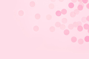 Pink festive confetti background.