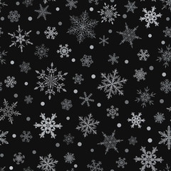 Christmas seamless pattern of snowflakes, gray on black background.