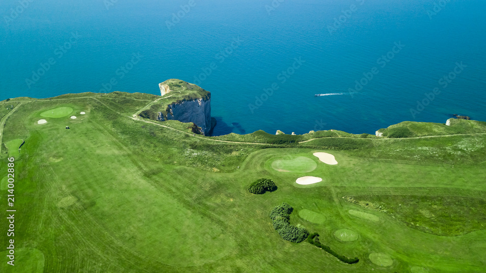 Drone view of a cliff side golf course next to the ocean in Etretat ...