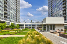 Luxury Apartment Building Features Open-air Park.