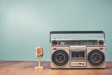 Wall Mural - retro outdated portable stereo boombox radio receiver with cassette recorder from circa 80s and gold