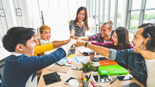 Multiethnic Diverse Group Of Office Coworker Or Business Partner Fist Bump In Modern Office. Colleague Partnership Teamwork, University Student, Congratulation Event, Job Or Mission Accomplish Concept