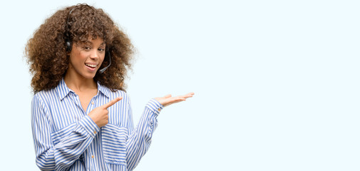 Poster - African american call center operator woman very happy pointing with hand and finger