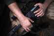 © Stavros - soldier hands and Sniper rifle close up. war.