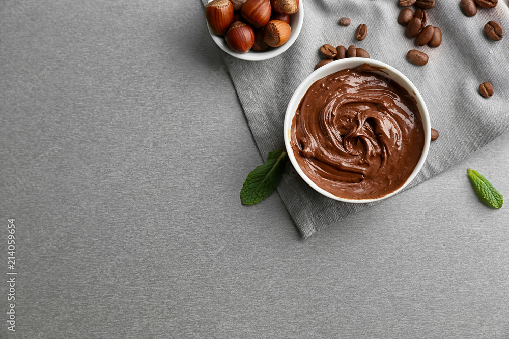 Bowl with molten chocolate on  table