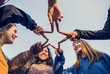 © Rawpixel.com - Group of friends using fingers to form the star shape teamwork and support concept