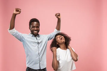 Winning success woman happy ecstatic celebrating being a winner. Dynamic energetic image of female afro model