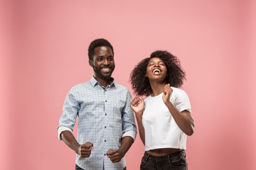 Winning success woman happy ecstatic celebrating being a winner. Dynamic energetic image of female afro model