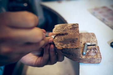 Wall Mural - Different goldsmiths tools on the jewelry workplace. Jeweler at work in jewelry.