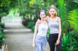 © iStocker - Two asian women standing in the garden ,There are feeling happy and relax