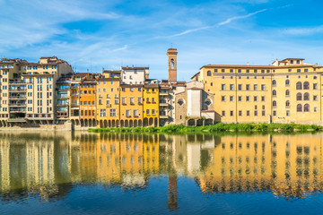 Colorful old buildings line the Arno River in Florence, Italy