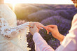 Marriage proposal in a field of lavender in the evening at sunset.