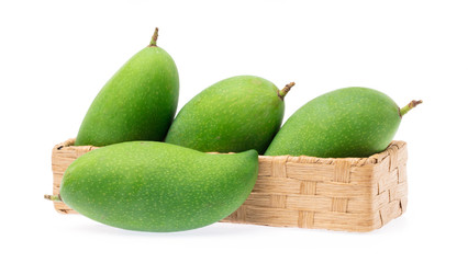 Bamboo basket of fresh mango isolated on a white background.