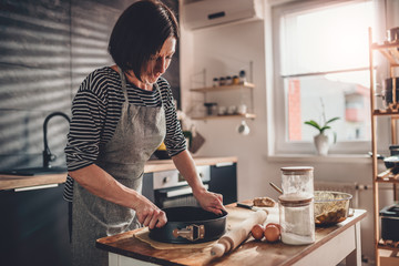 Wall Mural - Woman preparing pie crust dough