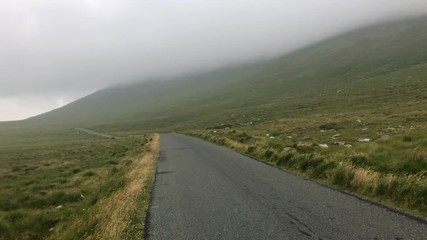 Wall Mural - On the misty road. Landscape in Achill Dooega, Ireland