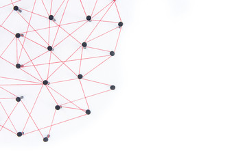connecting networks concept - network connected with yarn red on white paper with copy space. simula