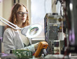 © Westend61 - Female technician working in electronic laboratory