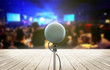 The microphone isolated on the blurry image of the stage in the meeting room or celebration festival during a night show abstract background.