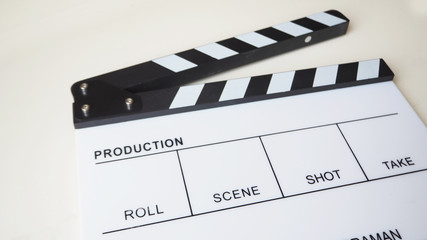  Clapper board or movie slate use in video production or movie and cinema industry. It's white color on white background.