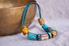 Handmade Necklace From Polymer Clay In Turquoise, Brown And Yellow Colors. Boho Ethnic Jewelry. Fashion Unique Background.