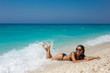 © Marko - Beautiful young woman lying on the beach