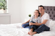 © New Africa - Father with his cute child in bedroom. Happy family