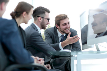 Sticker - business team discussing while sitting at their Desk