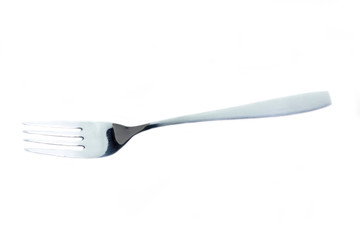 Metal fork on a white background seen from above