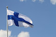 Finlands flag waving against the blue sky