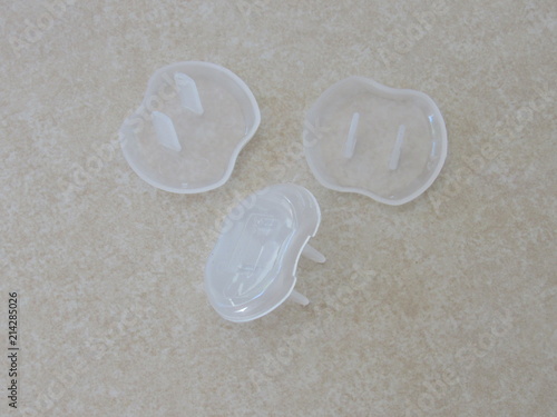 Foto White outlet safety covers to protect babies and children from electrocution