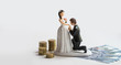 statuette of groom and bride with coins and dollars on white background. Wedding budget