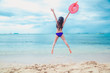 © A Stockphoto - Beautiful bikini asian teenage jumping on the beach