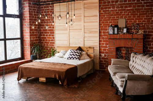 Simple Bedroom With Double Bed Red Brick Wall And Big