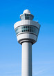 © DenisMArt - Flight control tower on blue sky background