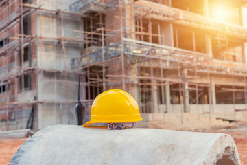 Yellow hard safety helmet hat for safety project of workman as engineer.