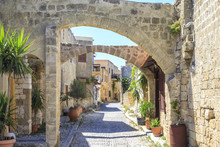Historical Streets Of Old Town Rhodes With Flowers In Rhodes, Dodecanese, Greece