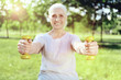 © zinkevych - Cute weights. Adorable little yellow hand weights being used by an active senior woman during her morning exercises