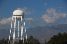 Water Tower With Mountains