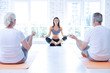 © zinkevych - Join us. Relaxed people sitting on the mats and crossing legs while meditating