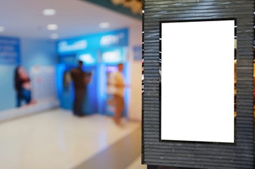 blank showcase billboard or advertising light box for your text message or media content with blurred view of people queuing to withdraw money from ATM, commercial, marketing and financial concept