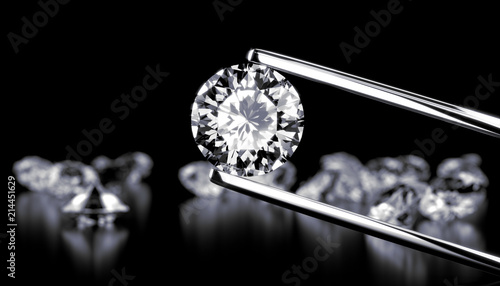 Fotomural Diamond in tweezers on a dark background with diamonds group soft focusing, 3d rendering