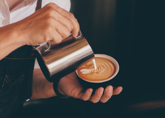 Wall Mural - close up barista hand making a cup of coffee.