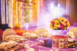 Colorful wedding reception dinner table decoration with flower bouquet