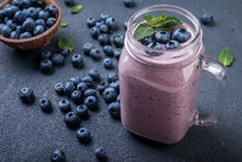  Smoothie Or Shake With Fresh Blueberries And Mint On A Dark  Background
