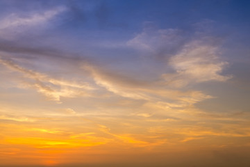 Wall Mural - sunset / sun rise sky with rays of yellow and red light shining clouds and sky background and textur