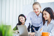 © Nattakorn - Young business woman working happy smile and relax in office