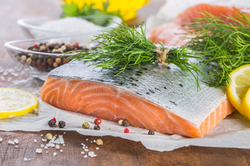 Raw salmon fillet with dill lemon olive oil salt and pepper