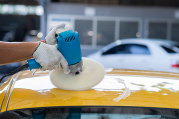 Wall Mural - Car detailing series: Polishing yellow sports car roof