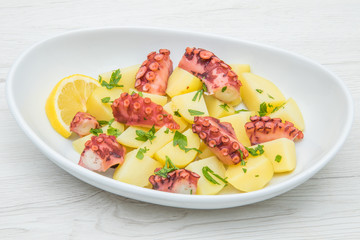 delicious plate of octopus salad with potatoes