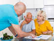© JackF - Upset old husband and wife signing agreement papers with social worker